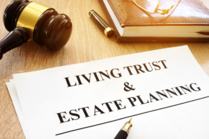 folder with living trust written on it.